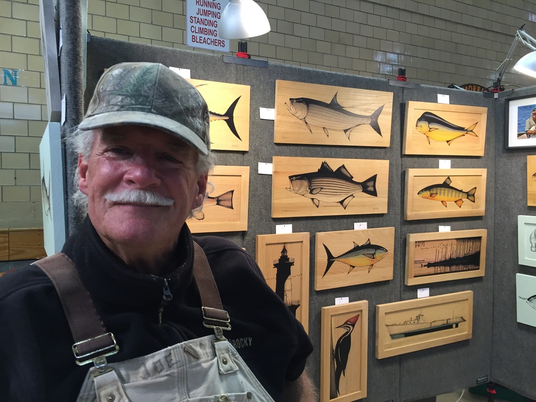 Russ Orme with his Pen and Ink Drawings on Wood