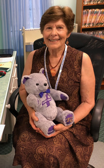 GNMC Volunteer with Alzheimer's Awareness Geo Teddy Bear